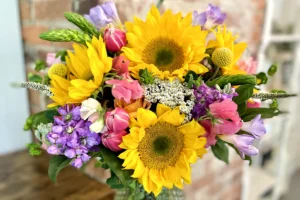 colorful flower arrangement of sunflower and tulips